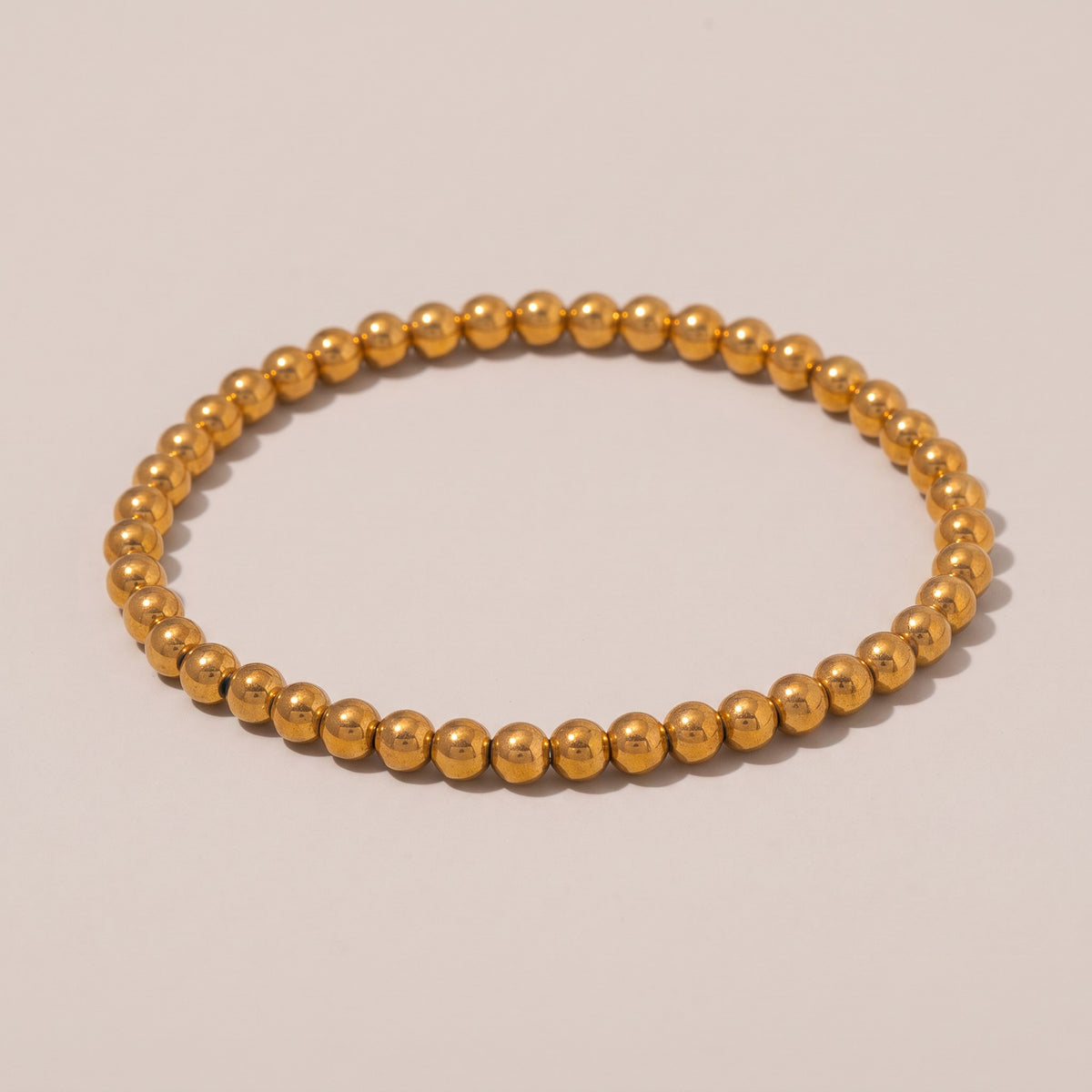 Caicos Beaded Bracelet in gold, polished round beads