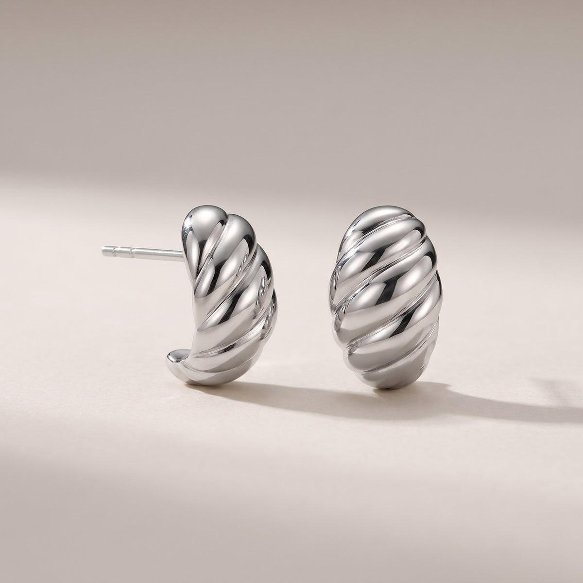 Croissant Huggie Earrings in silver