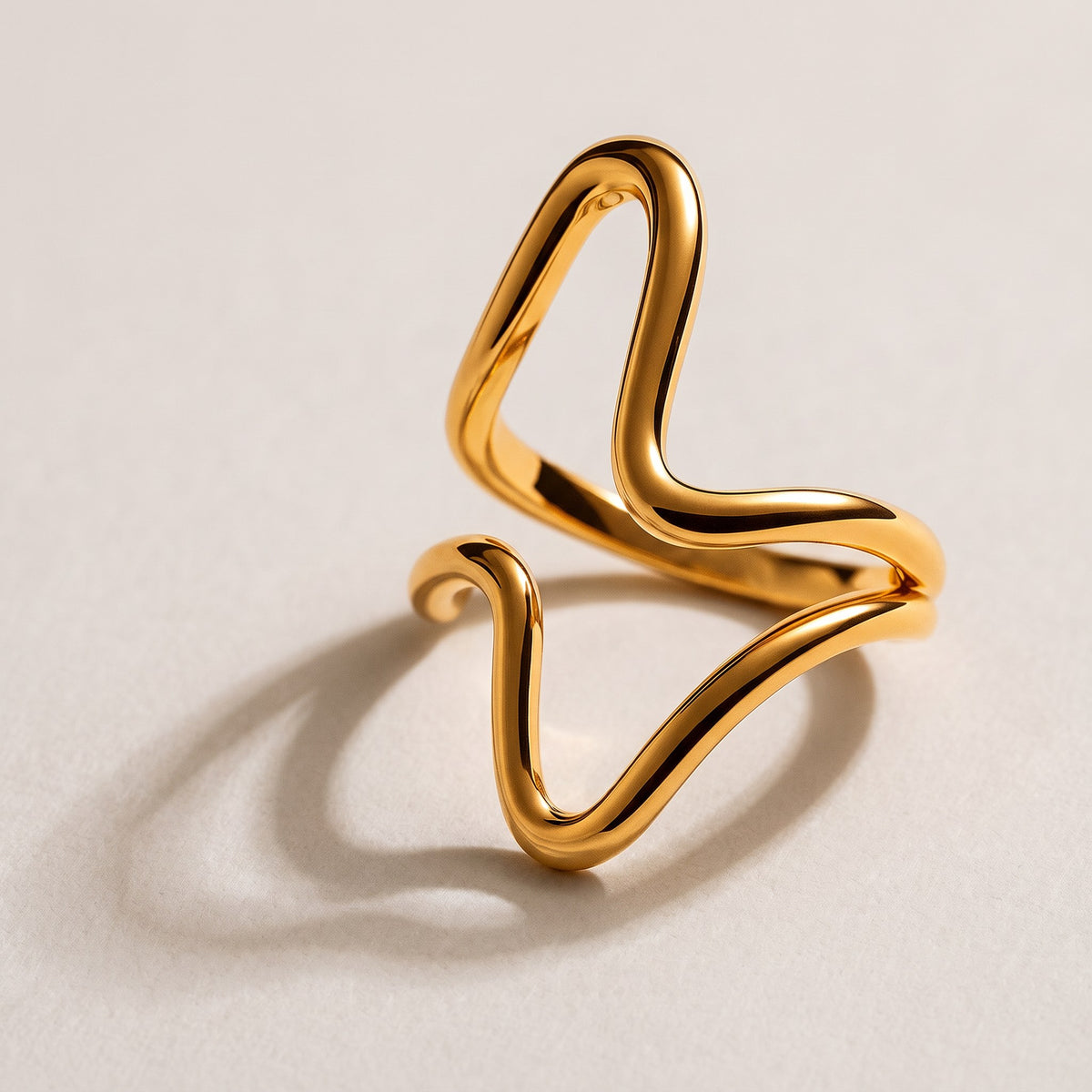 Isla Wave Ring in gold, an open sculptural wave ring