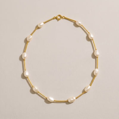 Maldives Necklace in gold with small oval freshwater pearls between gold bars