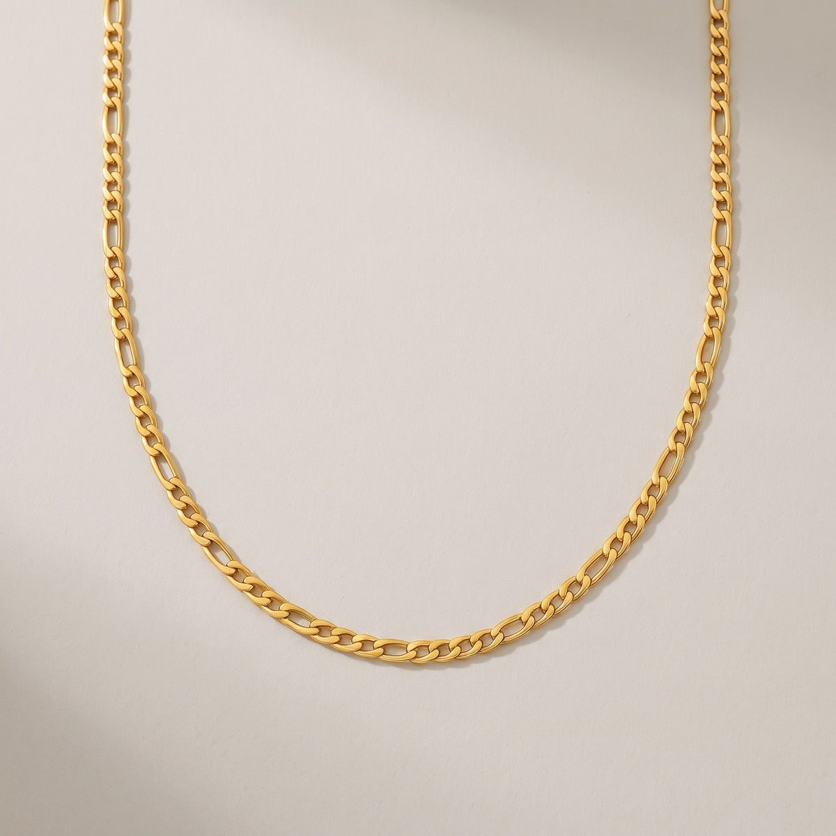 Positano Necklace in gold, a classic figaro chain